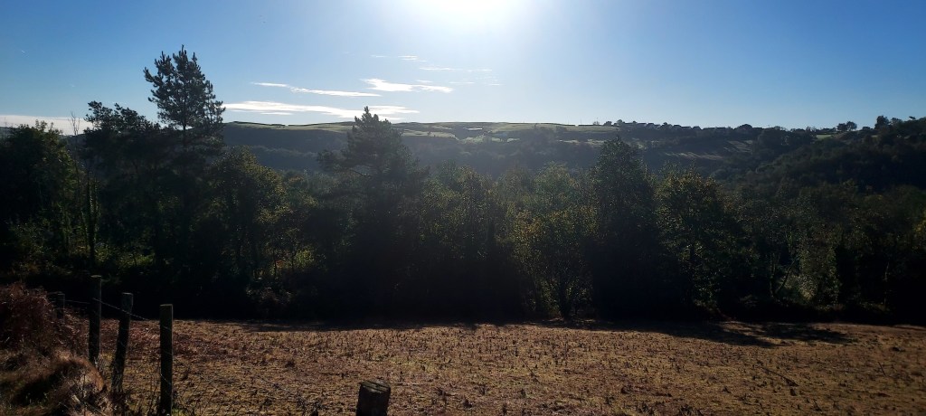 Low autumn sunshine over hillside views Low autumn sunshine over hillside views